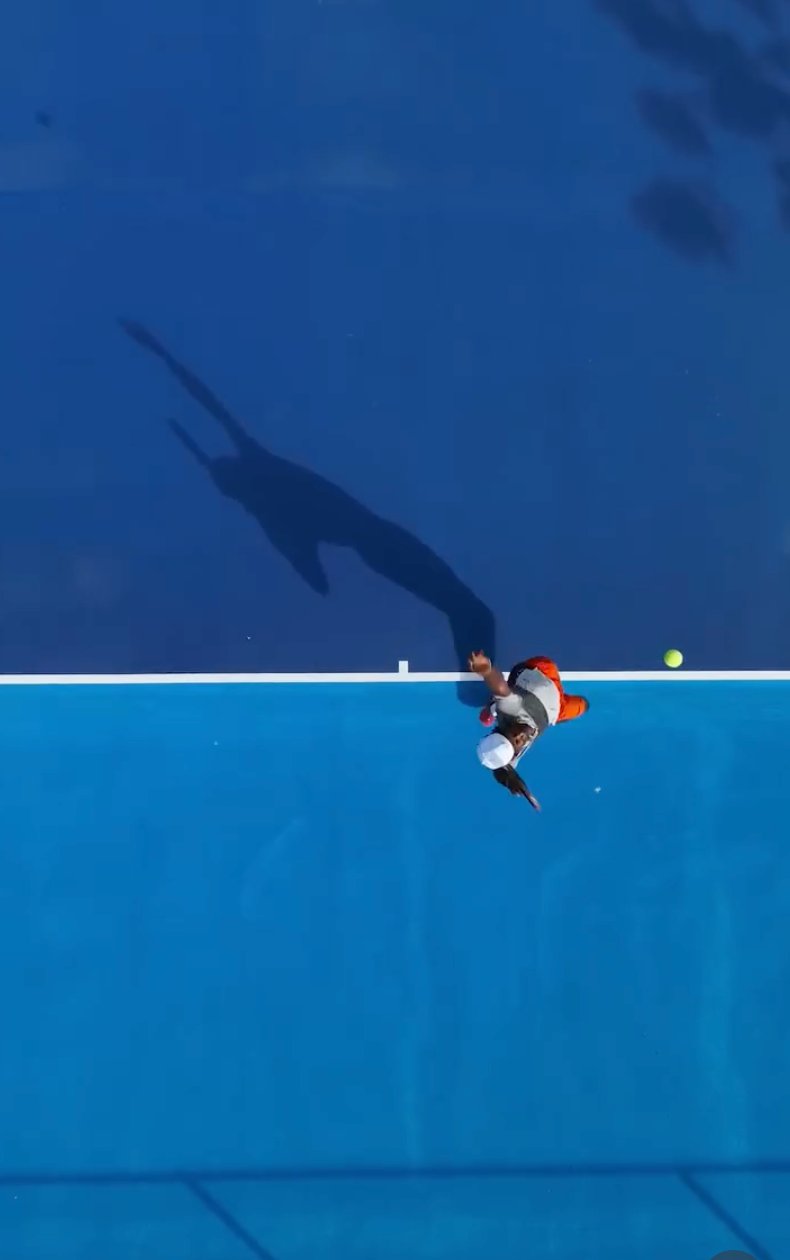 Overhead view of a player serving